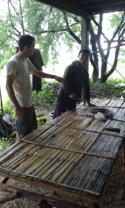 Sak Chai, our farm manager, and myself discussing next steps for the nursery. This is one of the finished tables.